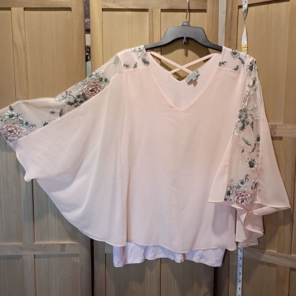 Joseph a pink flowy Pancho over tank blouse
